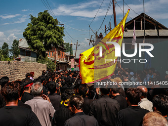 Kashmiri Shiite Muslims are chanting religious slogans as they take part in an Ashura procession during Muharram in Sopore, Jammu and Kashmi...