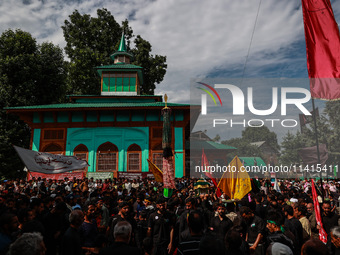 Kashmiri Shiite Muslims are chanting religious slogans as they take part in an Ashura procession during Muharram in Sopore, Jammu and Kashmi...