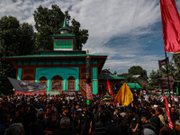 Kashmiri Shiite Muslims are chanting religious slogans as they take part in an Ashura procession during Muharram in Sopore, Jammu and Kashmi...