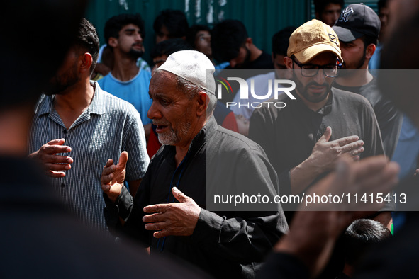 Kashmiri Shiite Muslims are chanting religious slogans as they take part in an Ashura procession during Muharram in Sopore, Jammu and Kashmi...