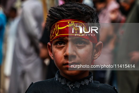 Kashmiri Shiite Muslims are chanting religious slogans as they take part in an Ashura procession during Muharram in Sopore, Jammu and Kashmi...