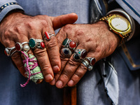 A Muslim man is wearing many rings as Kashmiri Shiite Muslims are chanting religious slogans while taking part in an Ashura procession durin...