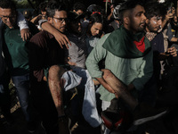 An anti-quota protestor is being rushed to the hospital after being shot by police during a clash in Dhaka, Bangladesh, on July 17, 2024. (