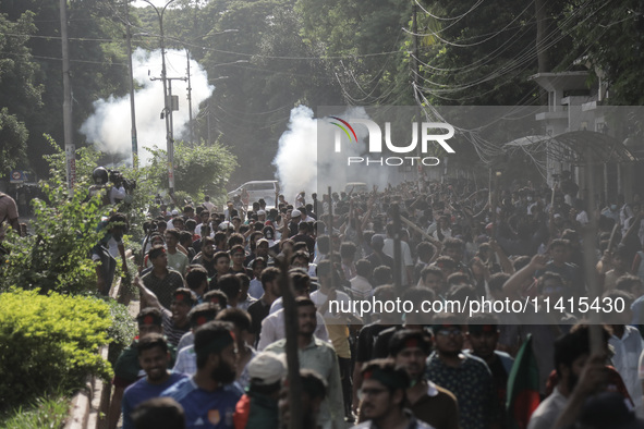 Police are firing tear gas towards anti-quota protestors in Dhaka, Bangladesh, on July 17, 2024. 