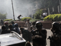 Anti-quota protestors are fleeing as police are firing tear gas and bullets towards them while approaching for a rally in Dhaka, Bangladesh,...