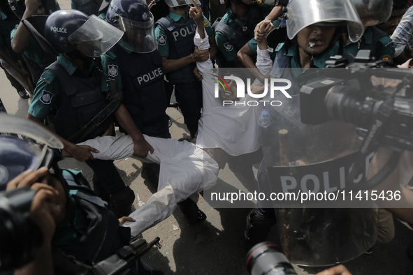 An anti-quota protestor is being arrested by police in Dhaka, Bangladesh, on July 17, 2024. 