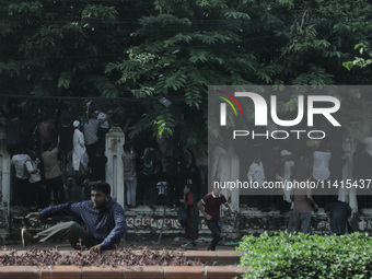 Anti-quota protestors are fleeing as police are firing tear gas and bullets towards them while approaching for a rally in Dhaka, Bangladesh,...