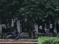 Anti-quota protestors are fleeing as police are firing tear gas and bullets towards them while approaching for a rally in Dhaka, Bangladesh,...