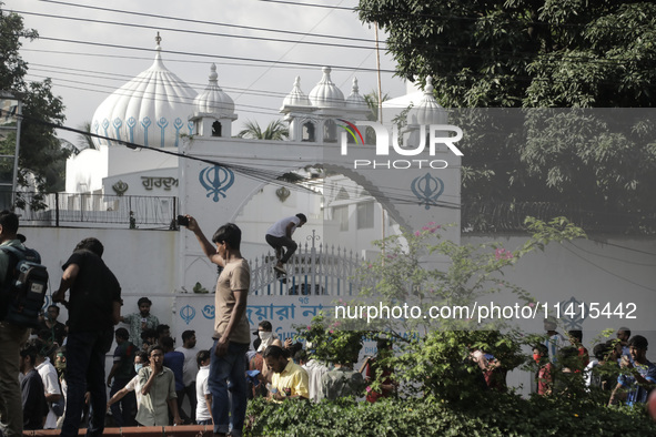 Anti-quota protestors are fleeing as police are firing tear gas and bullets towards them while approaching for a rally in Dhaka, Bangladesh,...