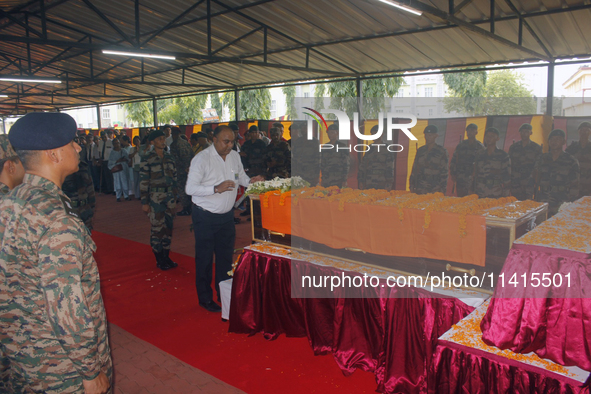 Indian ARMY personnel are paying respect in front of the coffin of martyred Army captain Brijesh Thapa, a resident of Darjeeling who was kil...