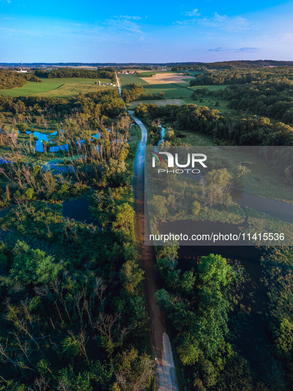 The Sugar River in Albany, WI, is swelling above flood stage after back-to-back derechos are hitting parts of the Midwest, including Wiscons...