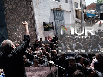 Shiite Muslim mourners are taking part in a religious procession on the tenth day of Ashura in the Islamic month of Muharram in Pireaus, Gre...