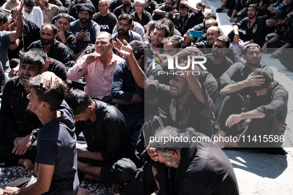 Shiite Muslim mourners are taking part in a religious procession on the tenth day of Ashura in the Islamic month of Muharram in Pireaus, Gre...