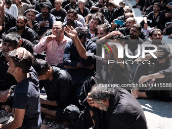 Shiite Muslim mourners are taking part in a religious procession on the tenth day of Ashura in the Islamic month of Muharram in Pireaus, Gre...