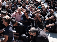 Shiite Muslim mourners are taking part in a religious procession on the tenth day of Ashura in the Islamic month of Muharram in Pireaus, Gre...