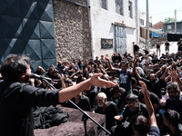 Shiite Muslim mourners are taking part in a religious procession on the tenth day of Ashura in the Islamic month of Muharram in Pireaus, Gre...