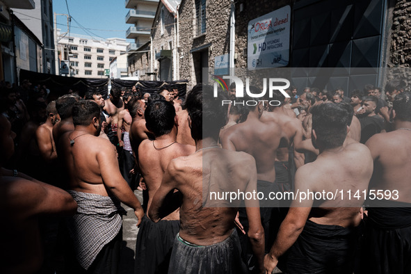 Shiite Muslim mourners are taking part in a religious procession on the tenth day of Ashura in the Islamic month of Muharram in Pireaus, Gre...