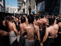 Shiite Muslim mourners are taking part in a religious procession on the tenth day of Ashura in the Islamic month of Muharram in Pireaus, Gre...