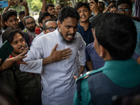 A man is arguing with police as he is not leaving the University of Dhaka premises, a day after the clash between Bangladesh Chhatra League,...