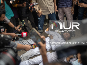 A man is arguing with police as he is not leaving the University of Dhaka premises, a day after the clash between Bangladesh Chhatra League,...