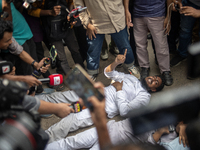 A man is arguing with police as he is not leaving the University of Dhaka premises, a day after the clash between Bangladesh Chhatra League,...