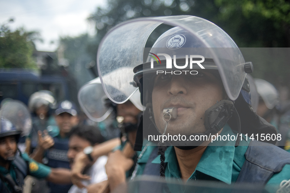 Police are detaining a man who is not leaving the University of Dhaka premises, a day after the clash between Bangladesh Chhatra League, the...