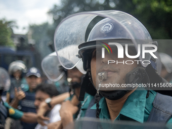 Police are detaining a man who is not leaving the University of Dhaka premises, a day after the clash between Bangladesh Chhatra League, the...