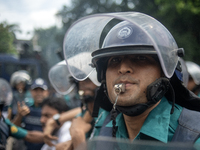 Police are detaining a man who is not leaving the University of Dhaka premises, a day after the clash between Bangladesh Chhatra League, the...