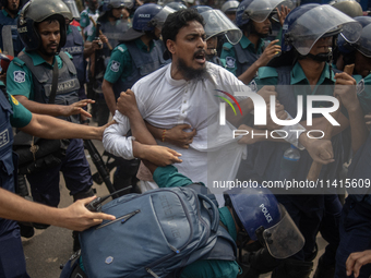 Police are detaining a man who is not leaving the University of Dhaka premises, a day after the clash between Bangladesh Chhatra League, the...