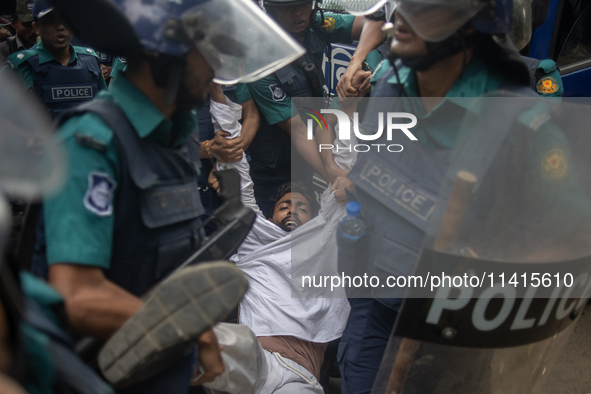 Police are detaining a man who is not leaving the University of Dhaka premises, a day after the clash between Bangladesh Chhatra League, the...