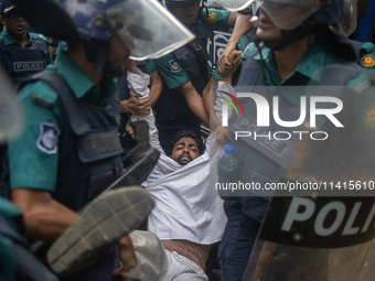 Police are detaining a man who is not leaving the University of Dhaka premises, a day after the clash between Bangladesh Chhatra League, the...