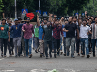 Anti-quota protesters are marching with a dummy coffin at the University of Dhaka, remembering those who are dying yesterday during the clas...