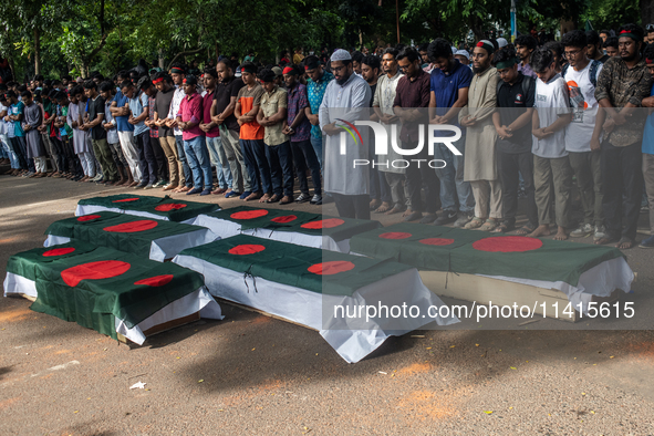 Anti-quota protesters are joining in a funeral prayer with a dummy coffin at the University of Dhaka, remembering those who are dying yester...