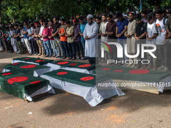 Anti-quota protesters are joining in a funeral prayer with a dummy coffin at the University of Dhaka, remembering those who are dying yester...