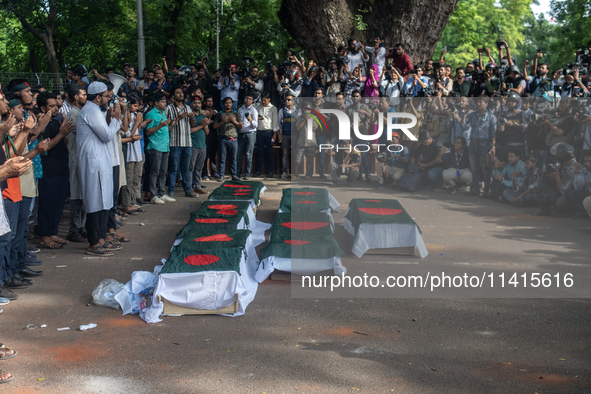 Anti-quota protesters are joining in a funeral prayer with a dummy coffin at the University of Dhaka, remembering those who are dying yester...