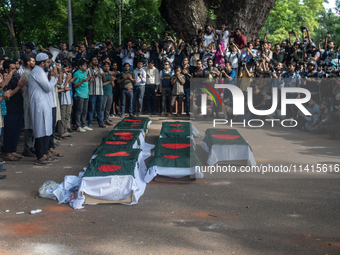 Anti-quota protesters are joining in a funeral prayer with a dummy coffin at the University of Dhaka, remembering those who are dying yester...