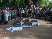 Anti-quota protesters are joining in a funeral prayer with a dummy coffin at the University of Dhaka, remembering those who are dying yester...