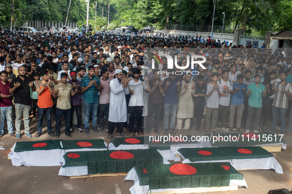 Anti-quota protesters are joining in a funeral prayer with a dummy coffin at the University of Dhaka, remembering those who are dying yester...