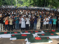 Anti-quota protesters are joining in a funeral prayer with a dummy coffin at the University of Dhaka, remembering those who are dying yester...