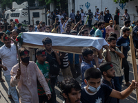 Anti-quota protesters are marching with a dummy coffin at the University of Dhaka, remembering those who are dying yesterday during the clas...