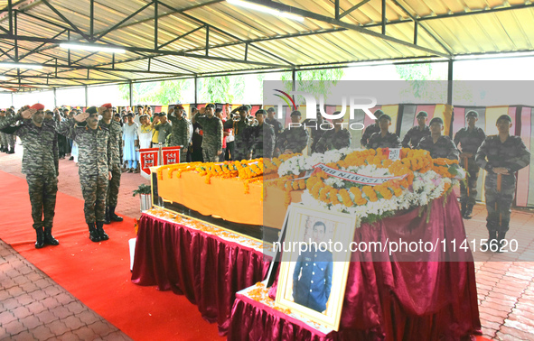 Indian ARMY personnel are paying respect in front of the coffin of martyred Army captain Brijesh Thapa, a resident of Darjeeling, who was ki...