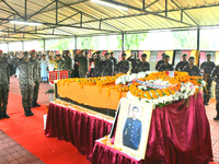 Indian ARMY personnel are paying respect in front of the coffin of martyred Army captain Brijesh Thapa, a resident of Darjeeling, who was ki...