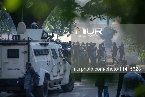 Police are firing teargas during a coffin rally of anti-quota protesters at the University of Dhaka, a day after the clash with Bangladesh C...