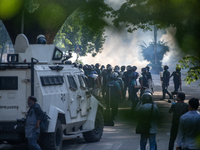 Police are firing teargas during a coffin rally of anti-quota protesters at the University of Dhaka, a day after the clash with Bangladesh C...