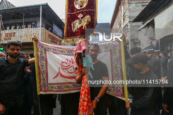 Kashmiri Shia Muslims are participating in the Ashura procession in Srinagar, Indian Administered Kashmir, on July 17, 2024. 