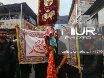 Kashmiri Shia Muslims are participating in the Ashura procession in Srinagar, Indian Administered Kashmir, on July 17, 2024. (