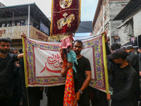 Kashmiri Shia Muslims are participating in the Ashura procession in Srinagar, Indian Administered Kashmir, on July 17, 2024. (