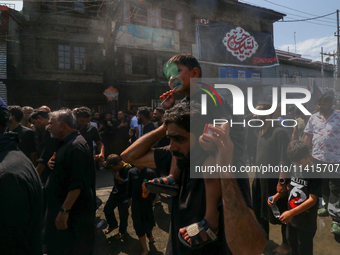 Kashmiri Shia Muslims are participating in the Ashura procession in Srinagar, Indian Administered Kashmir, on July 17, 2024. (