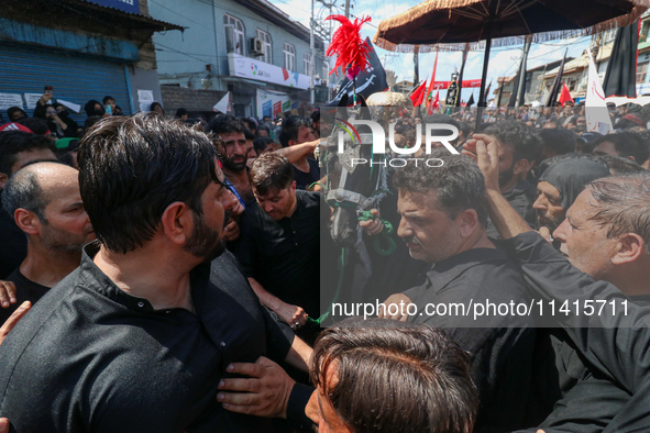 Kashmiri Shia Muslims are participating in the Ashura procession in Srinagar, Indian Administered Kashmir, on July 17, 2024. 