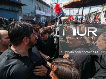 Kashmiri Shia Muslims are participating in the Ashura procession in Srinagar, Indian Administered Kashmir, on July 17, 2024. (